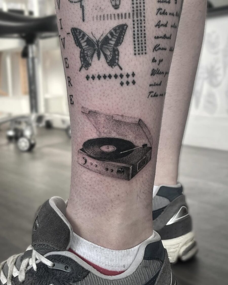 Stylish record player tattoo on leg Tattoo on skin
