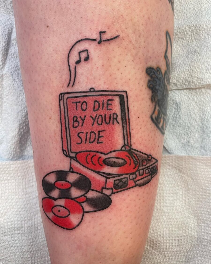 Unique record player tattoo with a heartfelt message Tattoo on skin