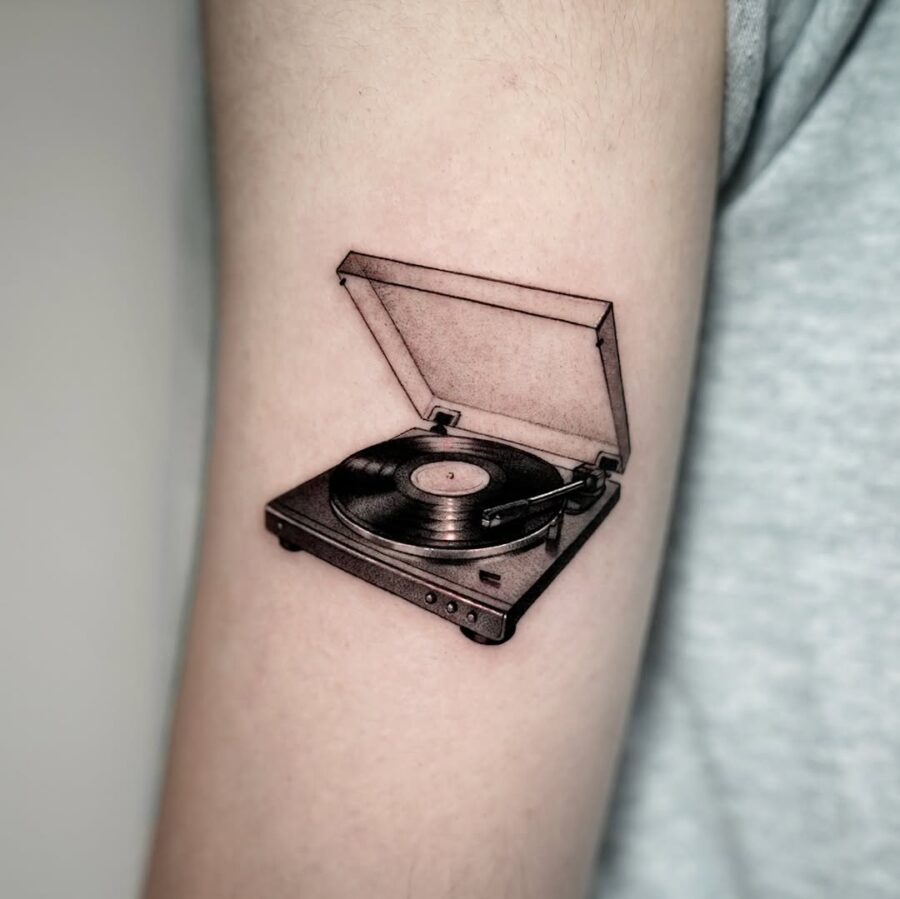 Vintage record player tattoo captures musical nostalgia Tattoo on skin