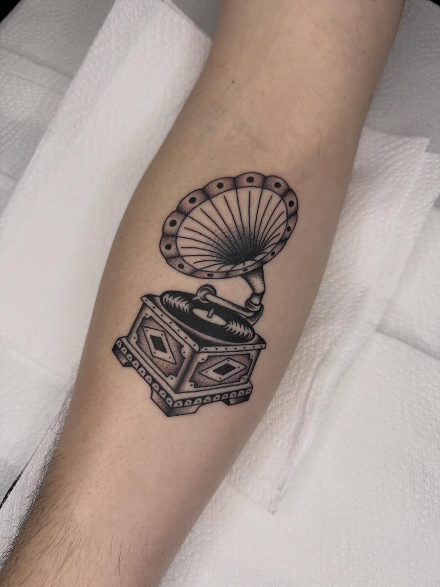 Vintage record player tattoo showcasing classic vibes Tattoo on skin