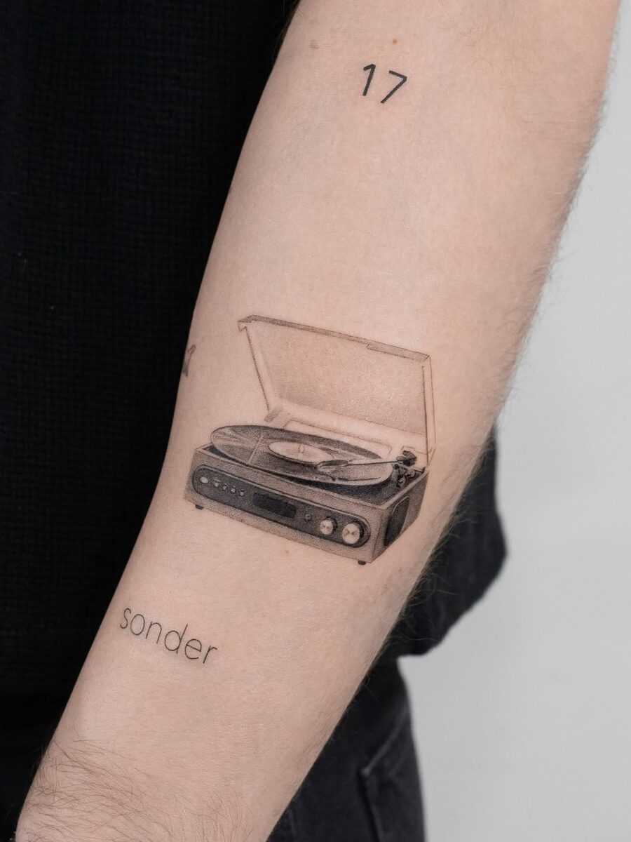 Vintage record player tattoo with heartfelt vibe Tattoo on skin