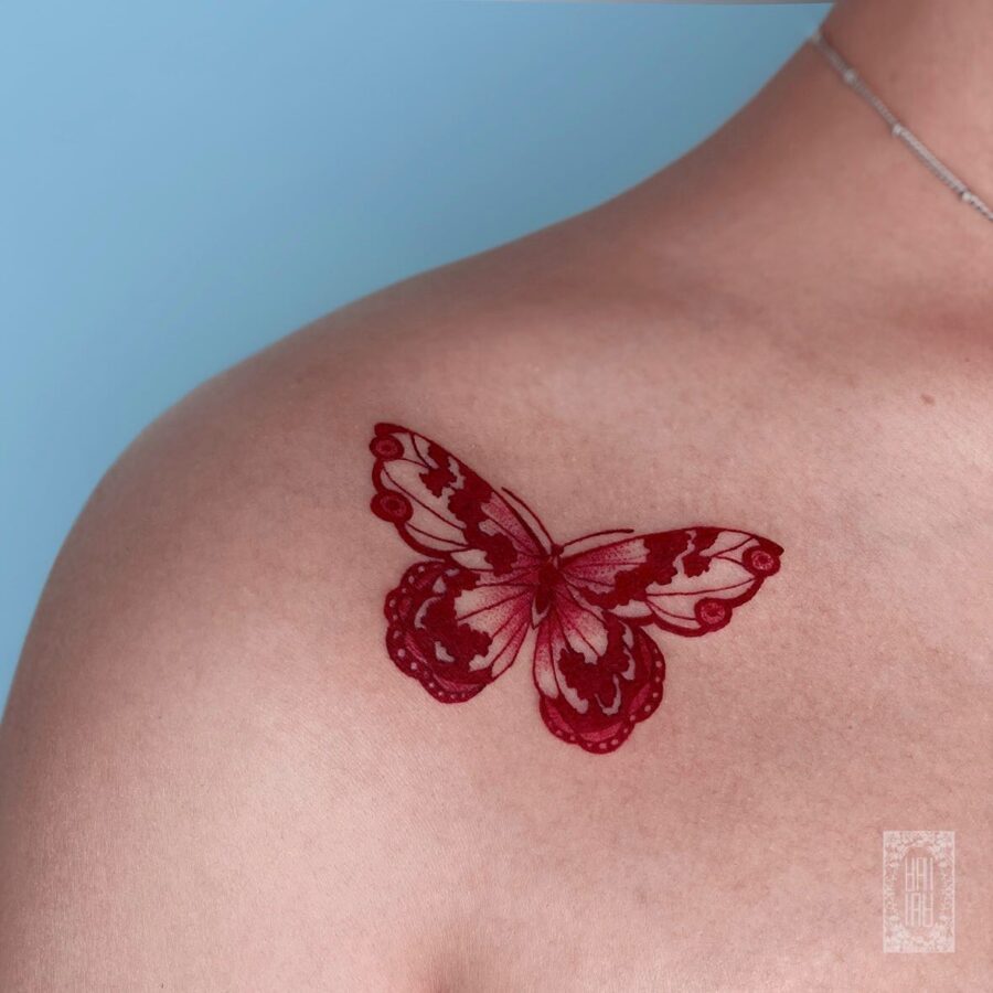 Elegant butterfly design in vibrant red ink Tattoo on skin