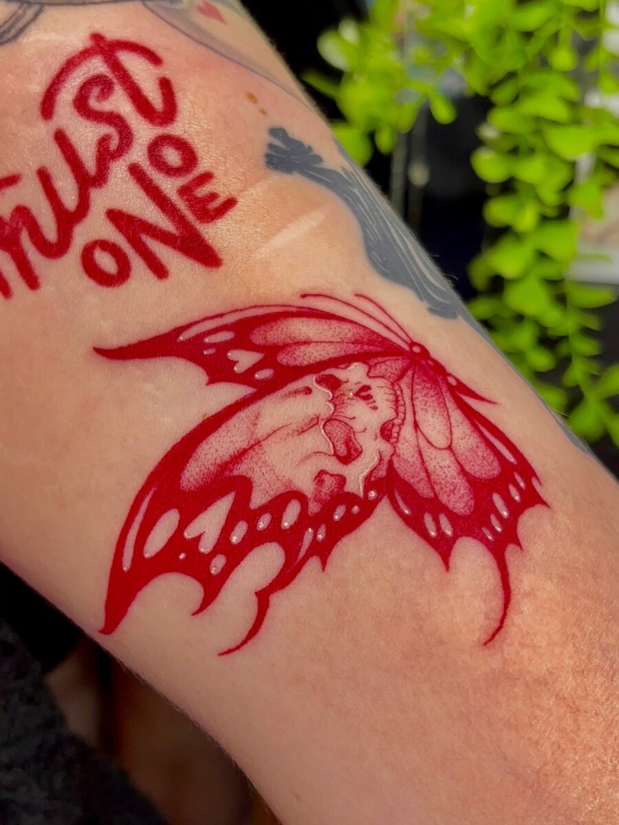 Elegant red ink butterfly tattoo design Tattoo on skin