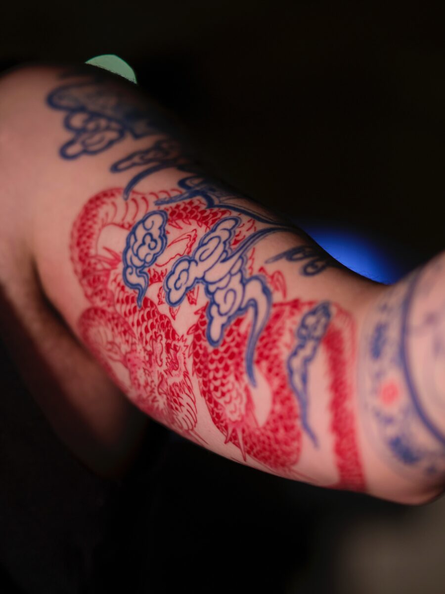 Intricate red ink dragon tattoo design Tattoo on skin