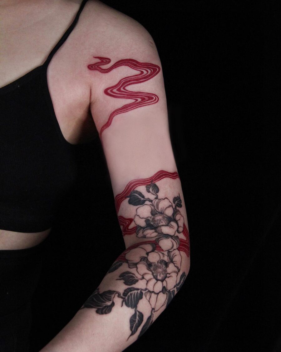 Striking Red Ink Flowing Tattoo Design Tattoo on skin