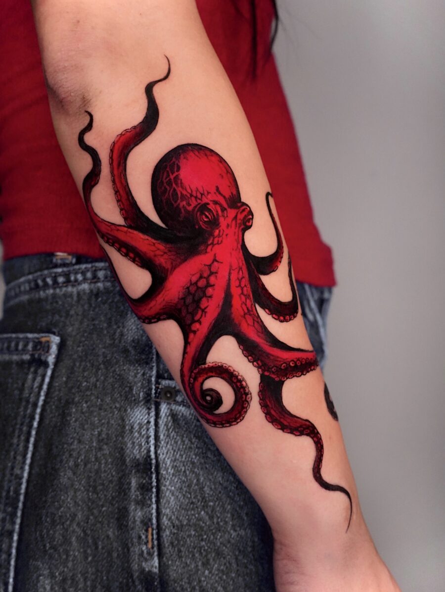 Striking red octopus tattoo showcases creativity Tattoo on skin