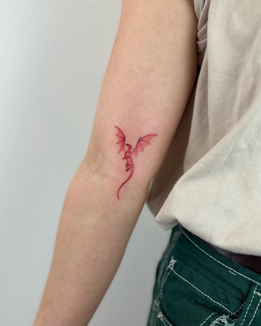 Stunning dragon design in vibrant red ink Tattoo on skin