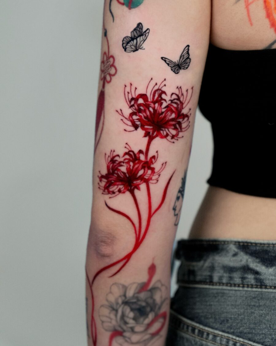Stunning Red Floral Tattoo Design on Arm Tattoo on skin