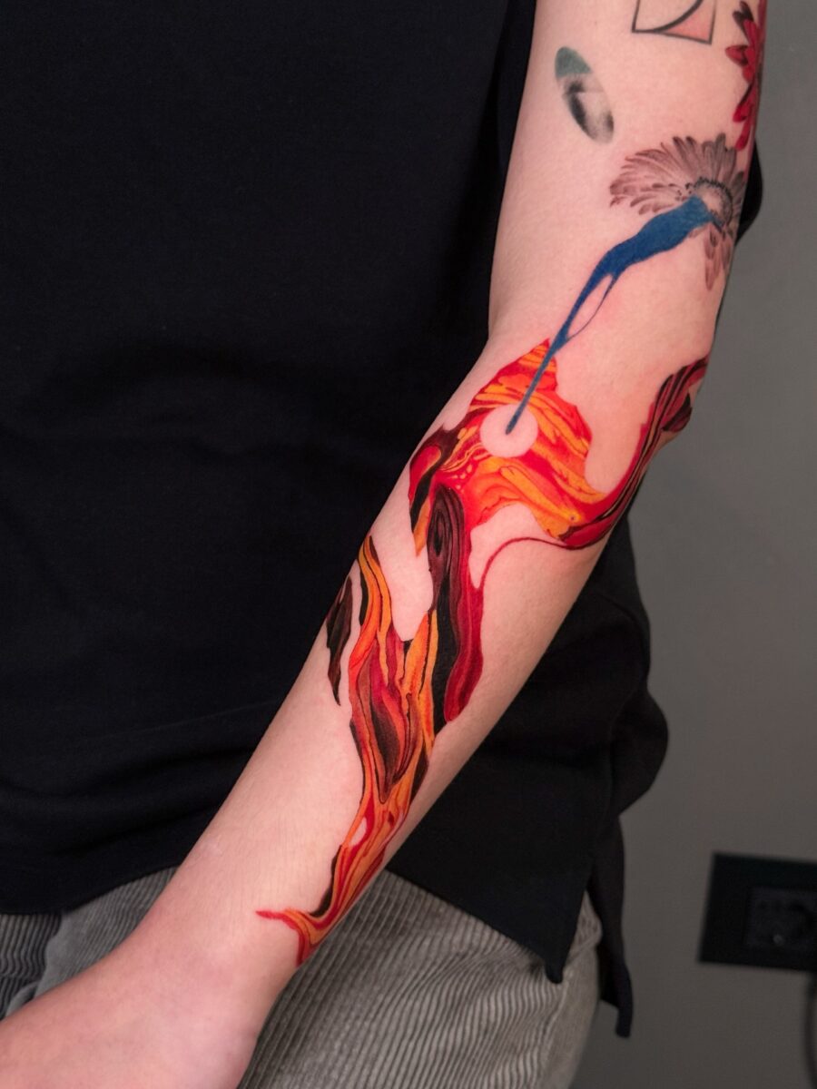 Vibrant flames intertwine in red ink art Tattoo on skin
