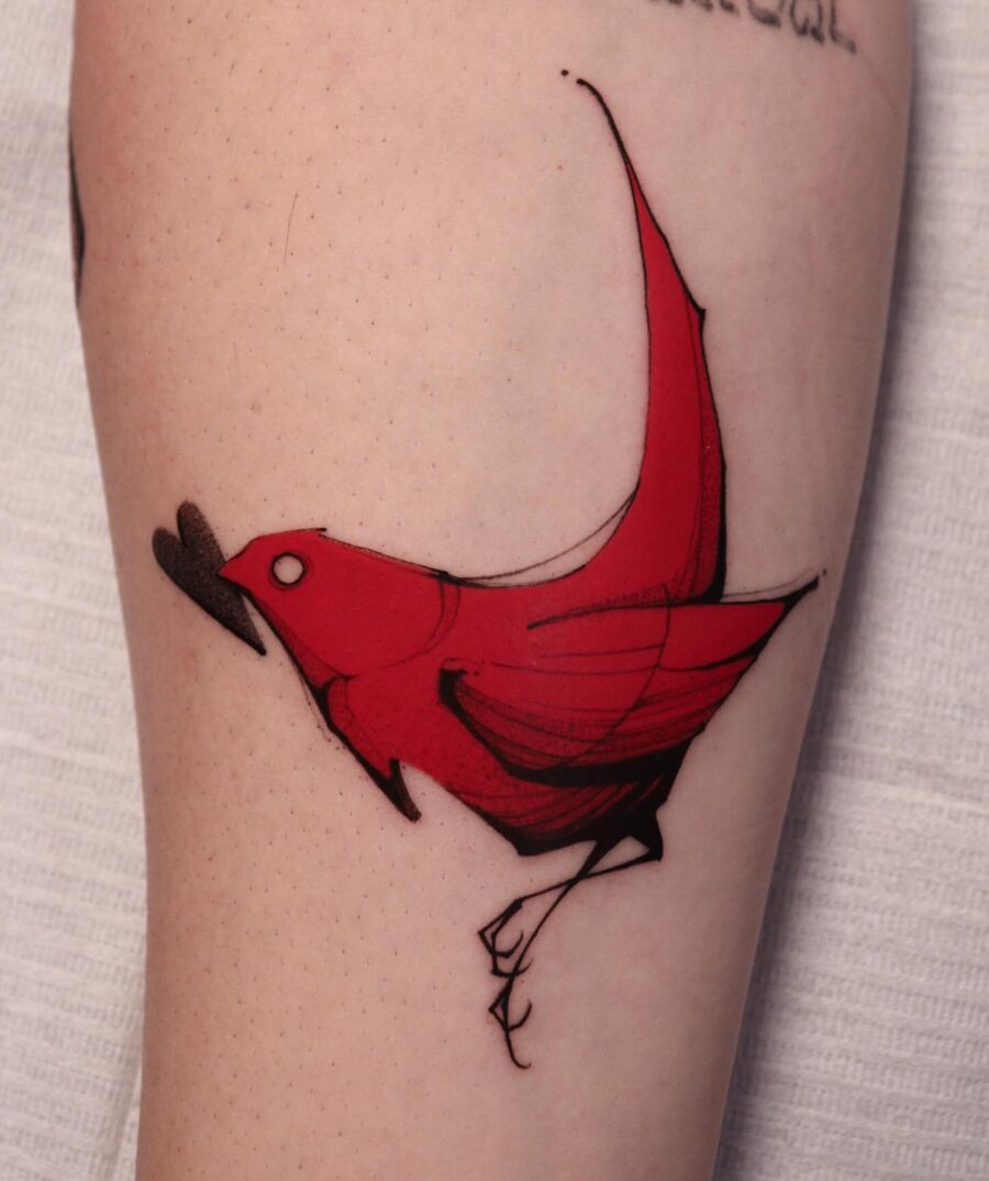 Vibrant red cardinal tattoo in bold style Tattoo on skin