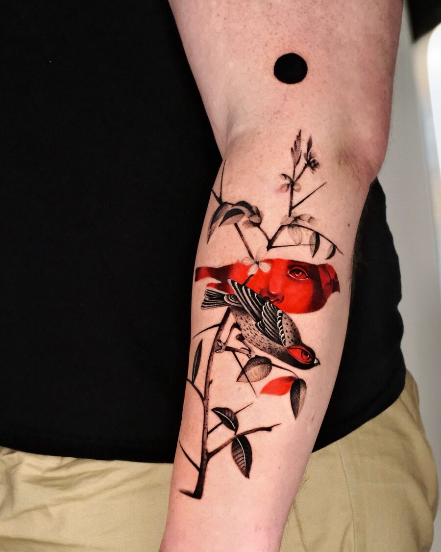 Vibrant Red Ink Bird Tattoo on Forearm Tattoo on skin
