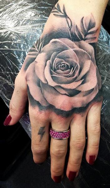 Sexy Rose Tattoo On A Girls Hand Tattoo on skin