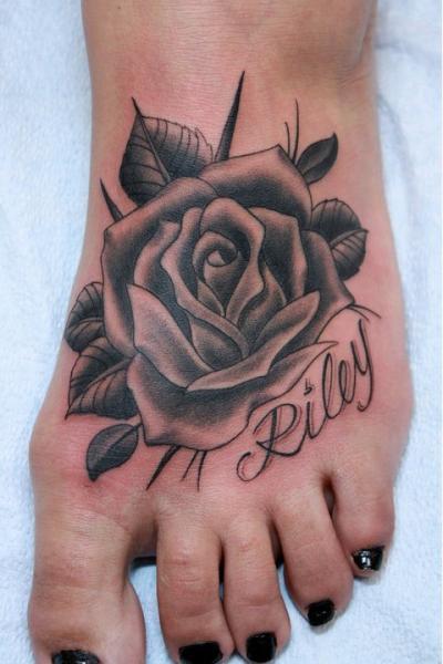 Single Rose Tattoo On A Guys Foot Tattoo on skin