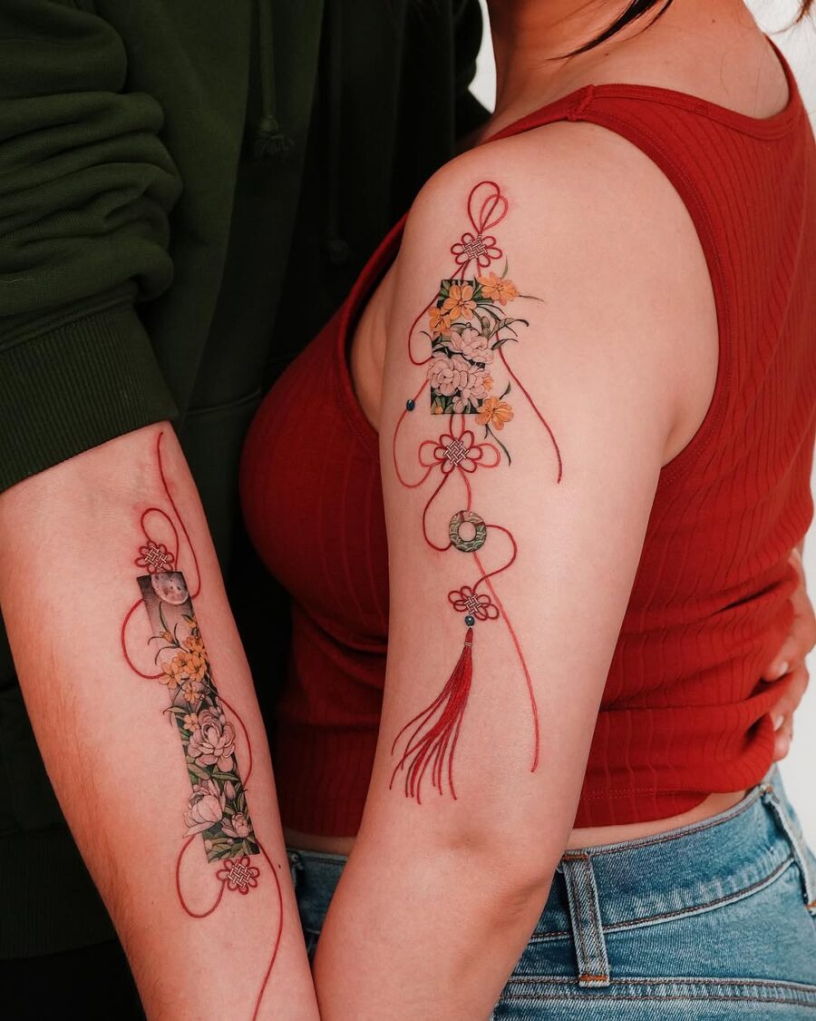 Beautiful couple tattoos featuring delicate floral designs Tattoo on skin