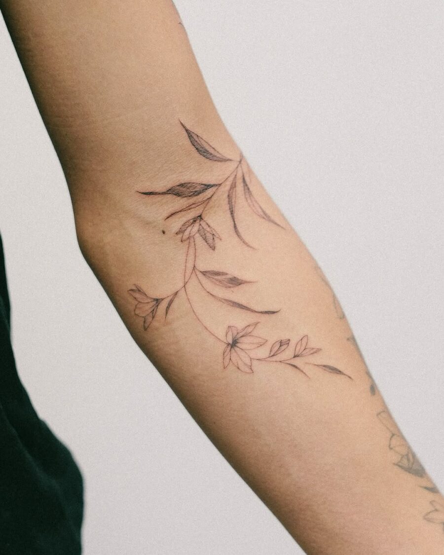 Delicate sampaguita flower tattoo on forearm Tattoo on skin