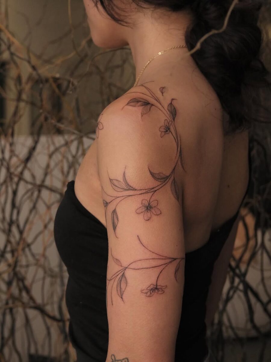 Elegant floral sampaguita tattoo adorns the arm Tattoo on skin