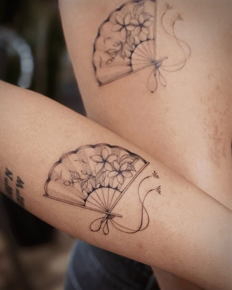 Elegant sampaguita fan tattoo with floral motifs Tattoo on skin