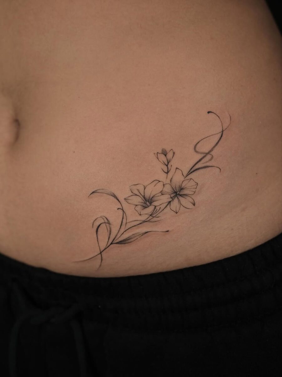 Elegant sampaguita tattoo hugging the body Tattoo on skin