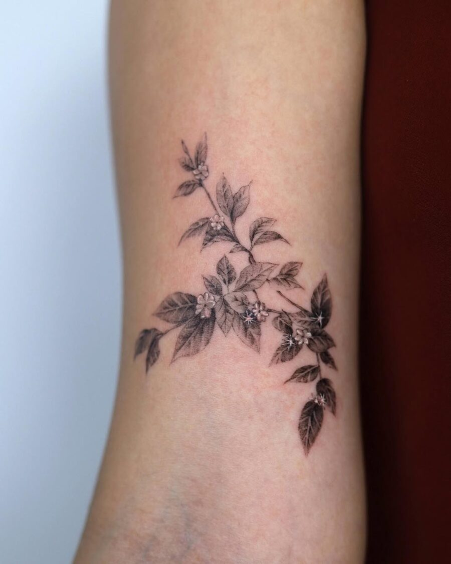 Elegant Sampaguita Tattoo with Detailed Floral Elements Tattoo on skin