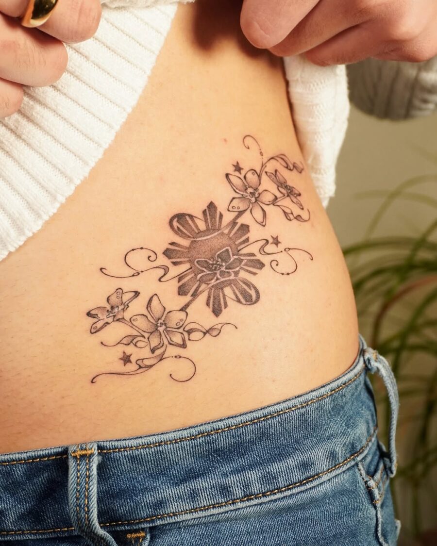 Elegant sampaguita tattoo with whimsical elements Tattoo on skin