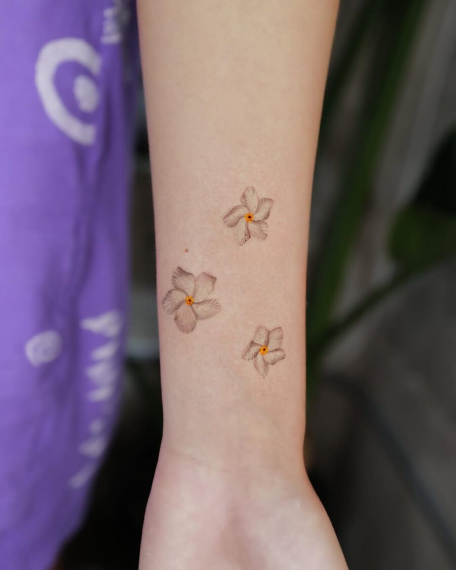 Three Elegant Sampaguita Tattoos on Forearm Tattoo on skin