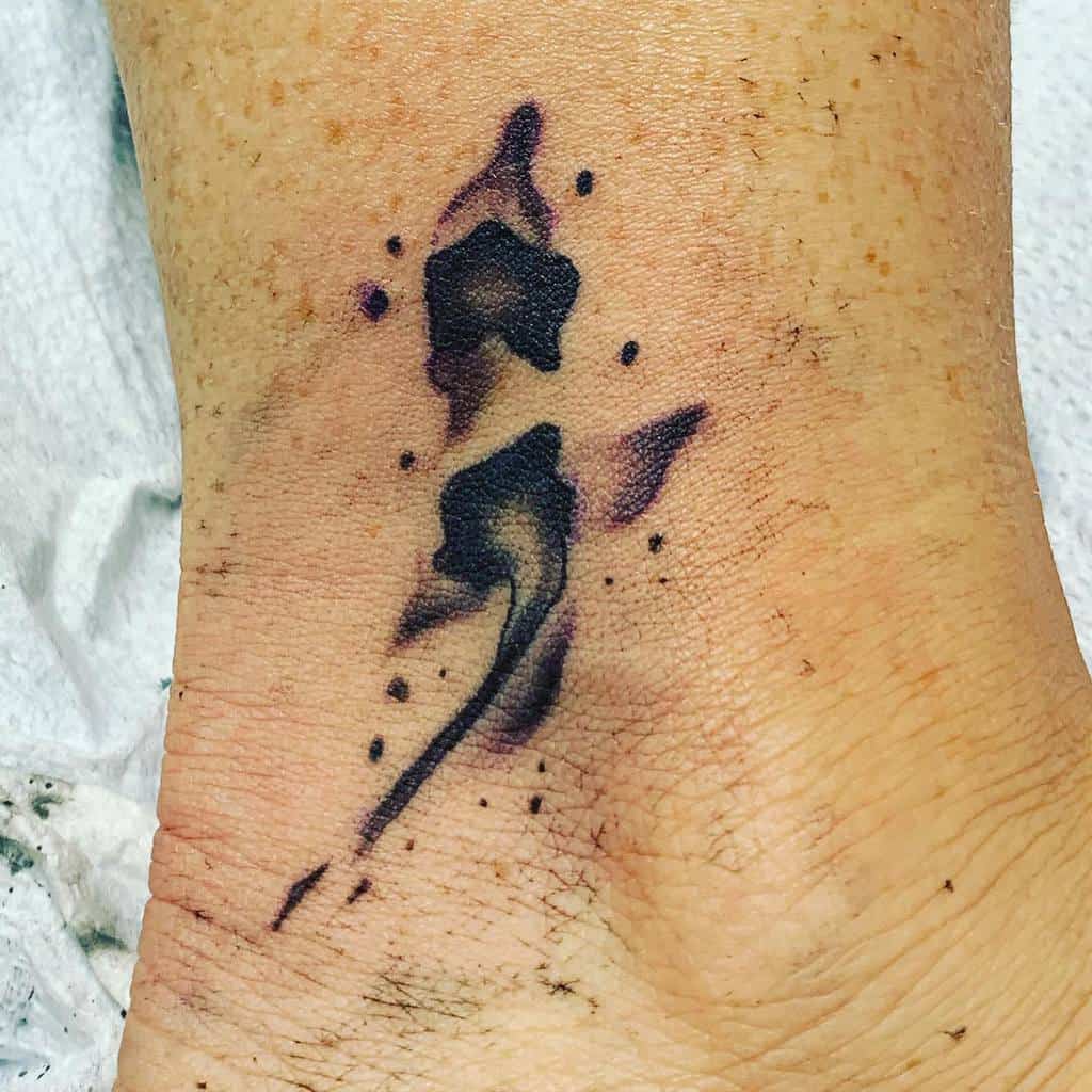 A Semicolon in an Inkblot Style Semicolon Tattoo Tattoo on skin