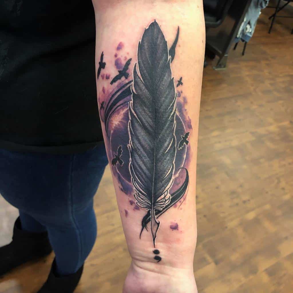 Black Quill with Crows over a Semicolon Tattoo on skin