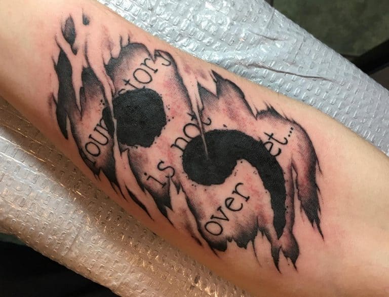 Semicolon on a Page Under Skin Tattoo on skin