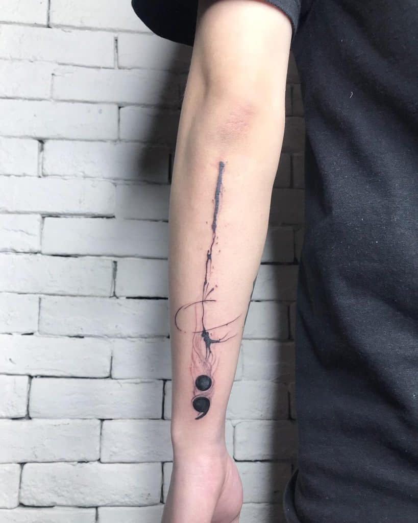Semicolon Under a Jagged Line Tattoo on skin