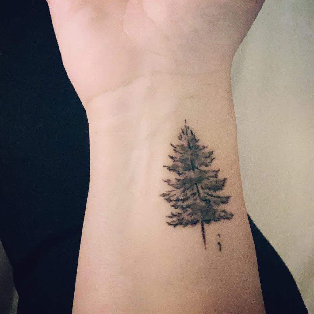 Simple Tree Tattoos Design with a Semicolon Tattoo on skin