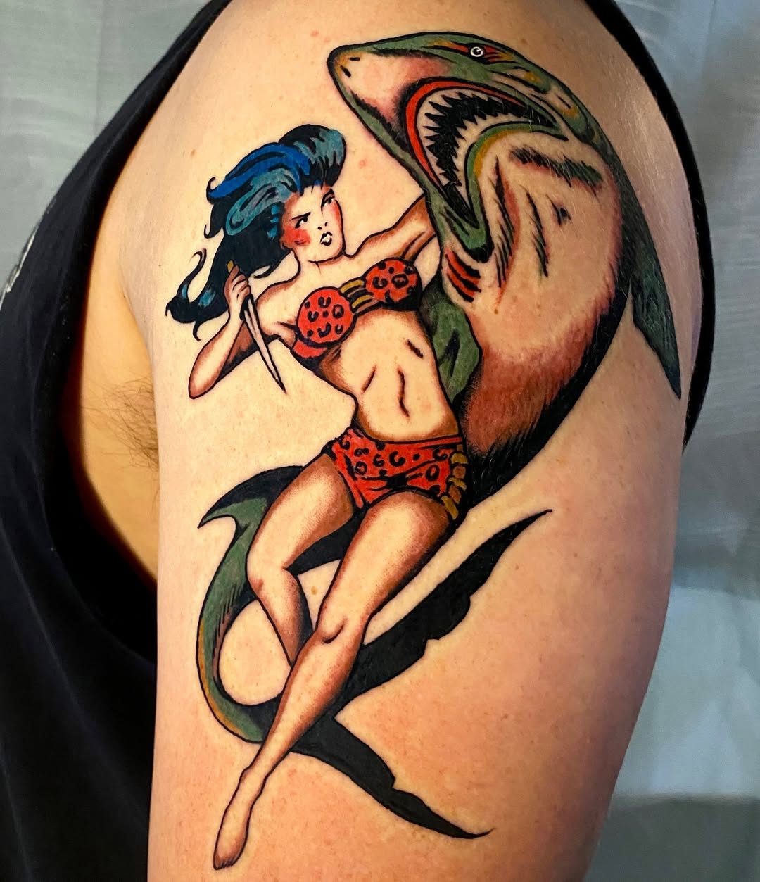 Bold and vibrant shark pinup tattoo design Tattoo on skin