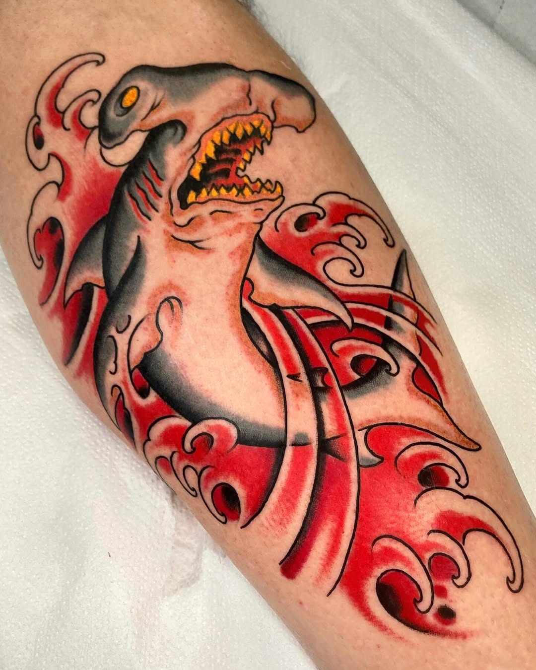 Bold shark tattoo with dramatic wave details Tattoo on skin