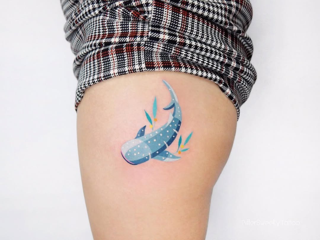 Colorful shark tattoo with vibrant aquatic design Tattoo on skin