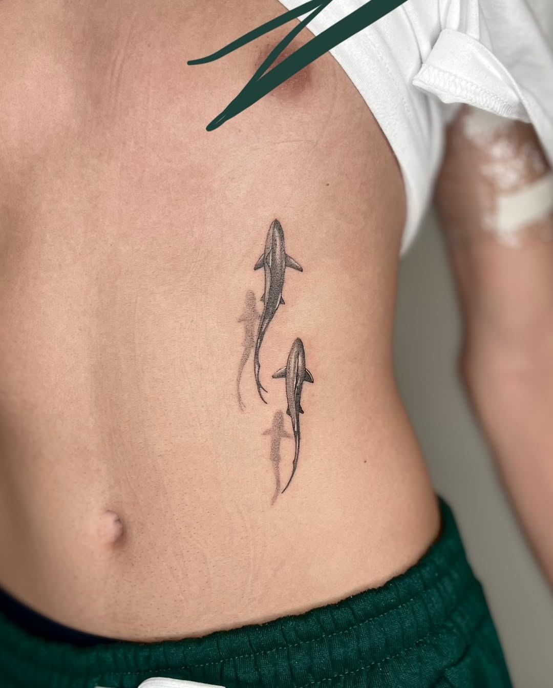 Minimalist Shark Tattoos on Ribs Tattoo on skin