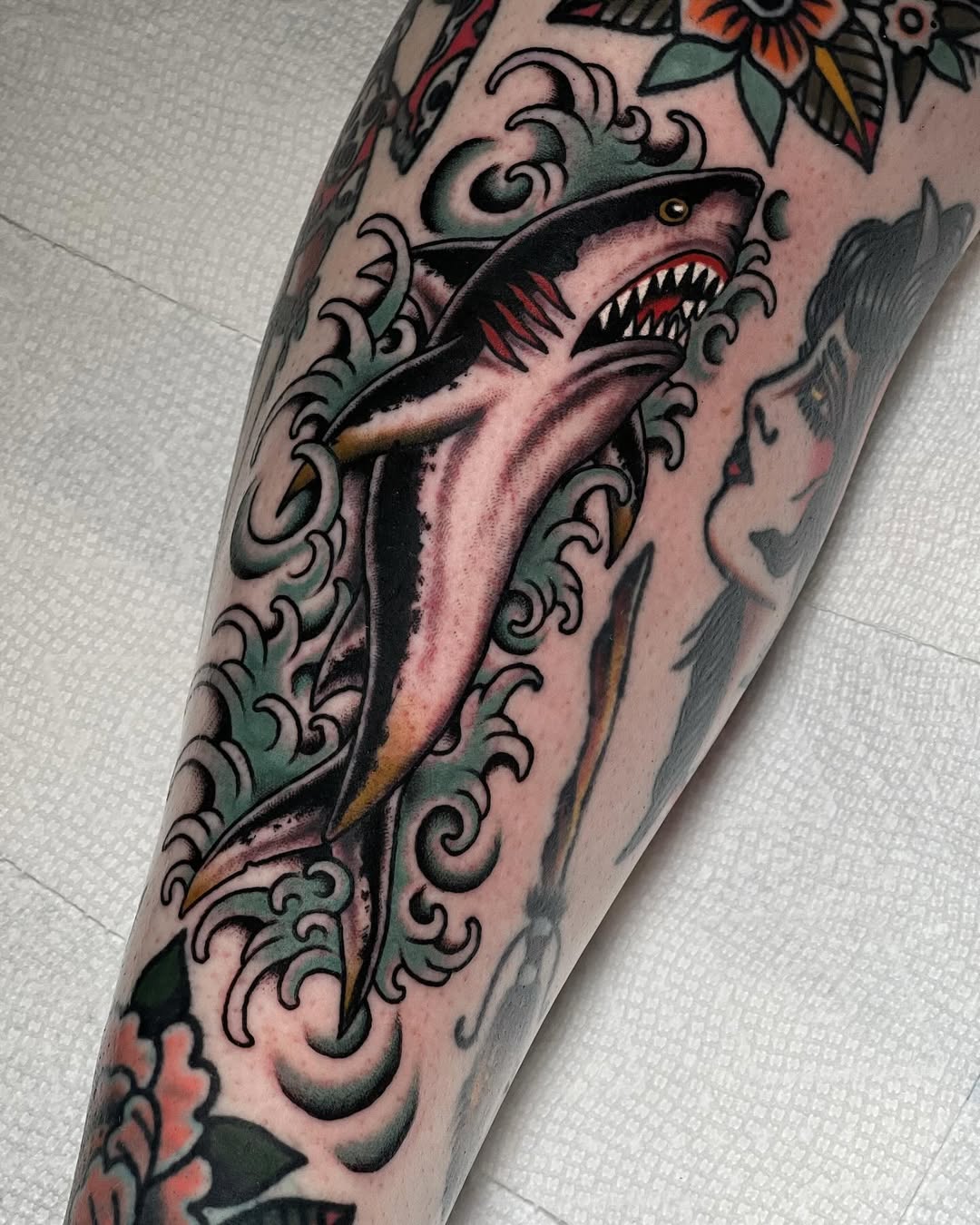 Stunning Shark Tattoo with Floral Accents Tattoo on skin