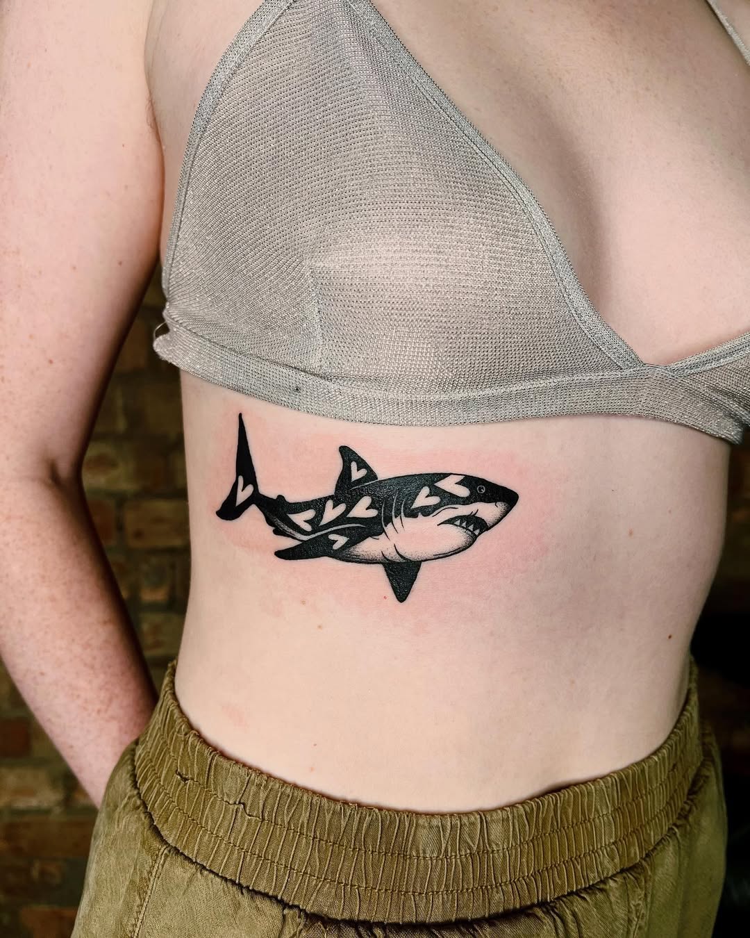 Stylish shark tattoo on rib area Tattoo on skin
