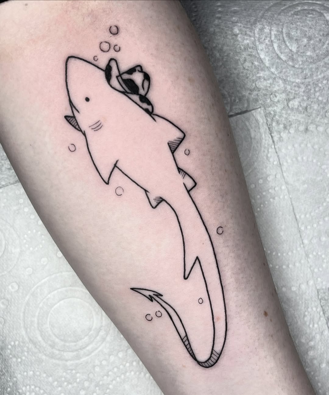 Stylish shark tattoo with a rose accent Tattoo on skin