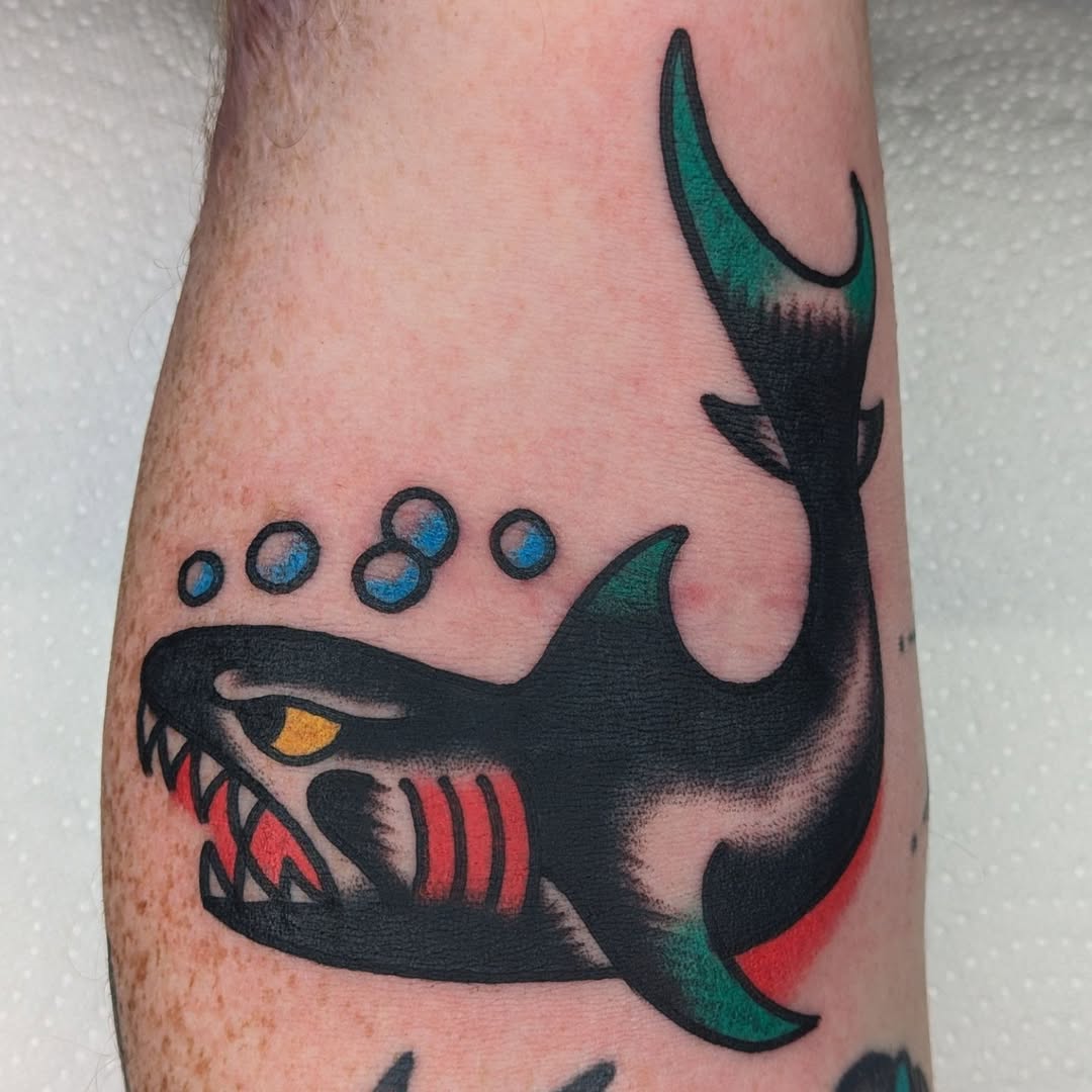 Stylish shark tattoo with vibrant colors Tattoo on skin