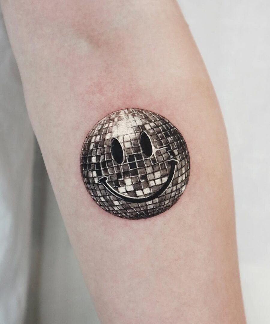 Cheerful silver ink disco ball design Tattoo on skin