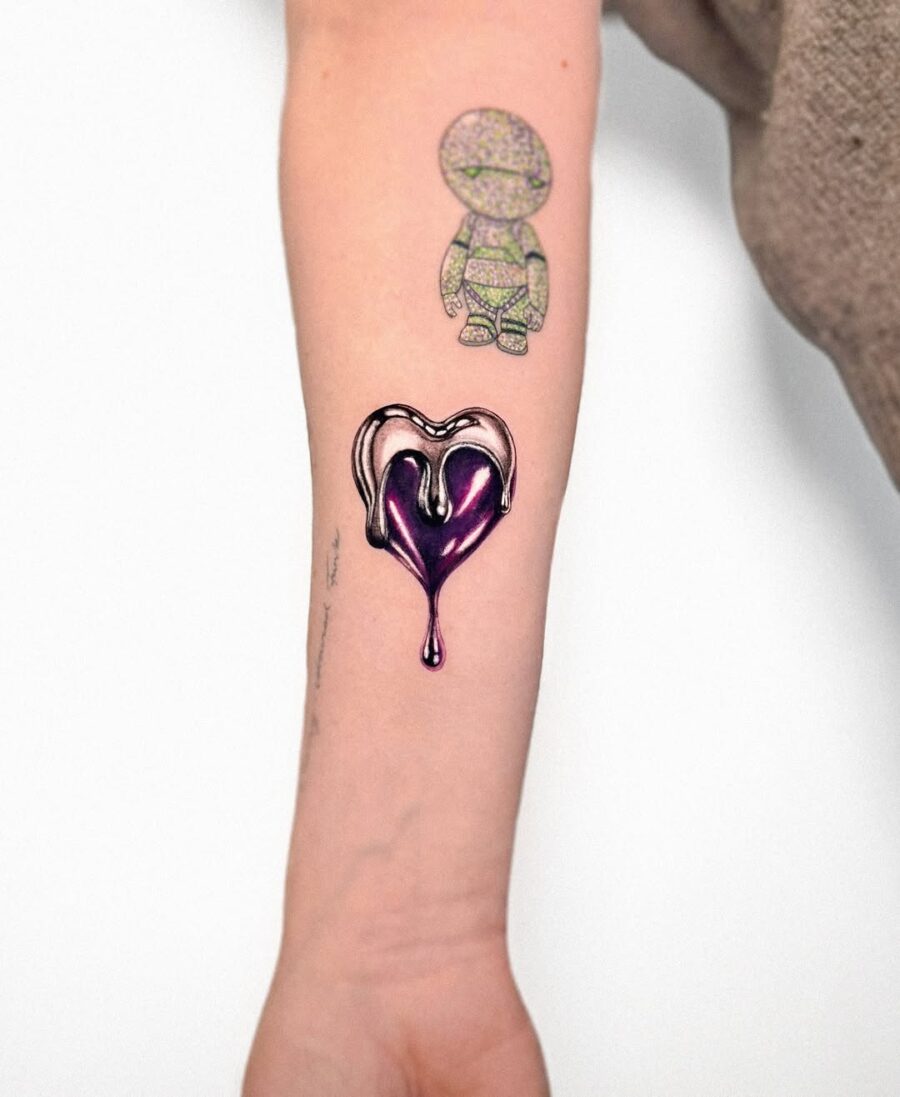Dripping silver ink heart tattoo concept Tattoo on skin