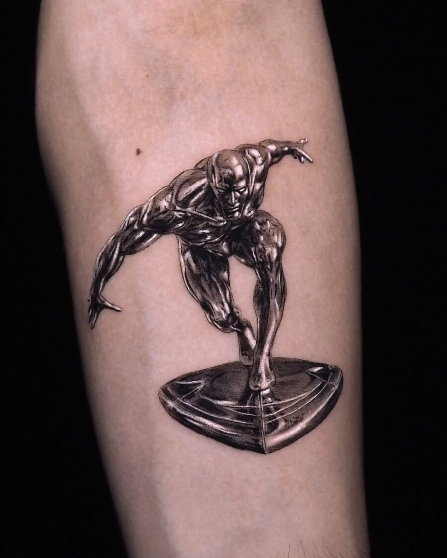Dynamic silver ink tattoo of a skateboarder Tattoo on skin