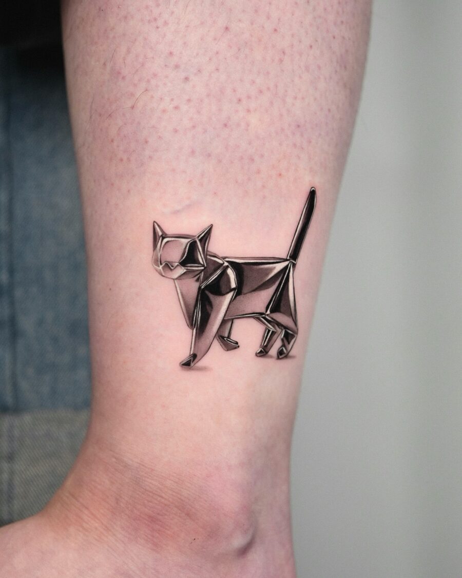 Elegant cat tattoo in silver ink design Tattoo on skin
