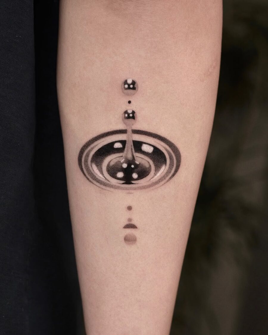 Intricate cosmic silver ink tattoo design Tattoo on skin