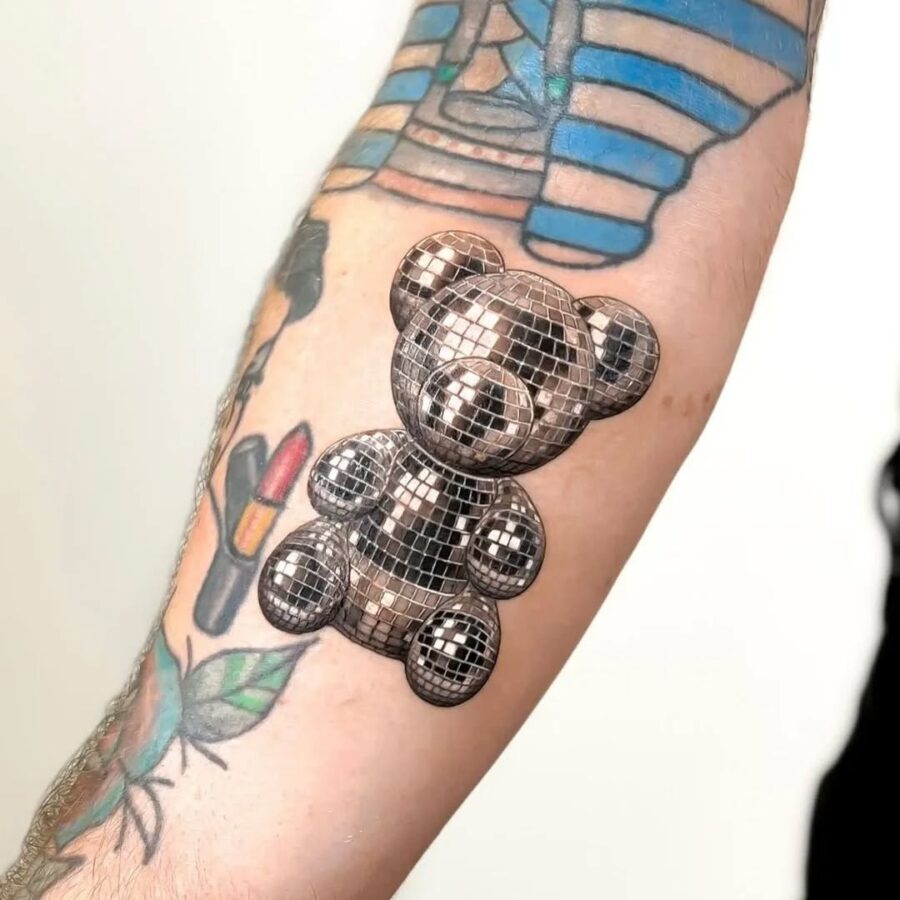 Shiny silver teddy bear tattoo design and vibe Tattoo on skin