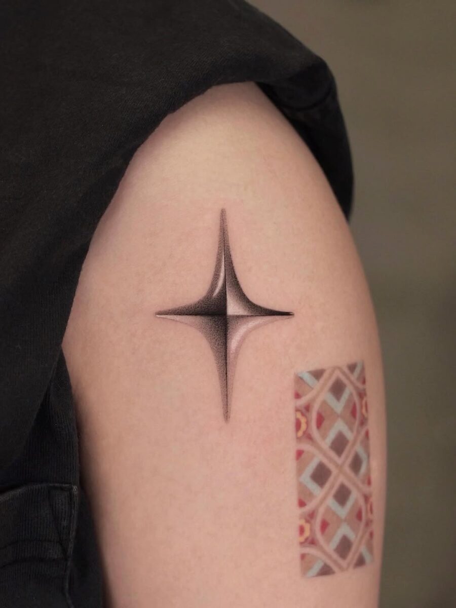 Sleek silver ink star tattoo design Tattoo on skin