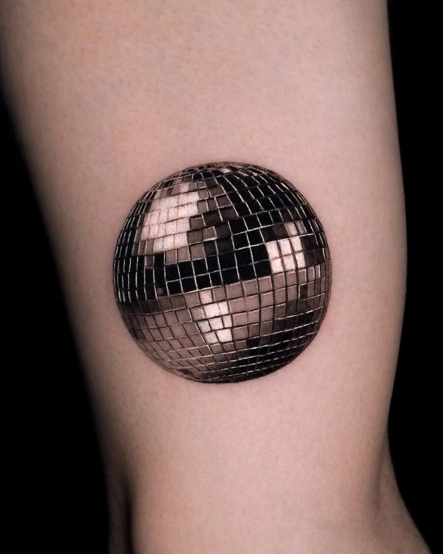Stylish silver ink disco ball tattoo concept Tattoo on skin