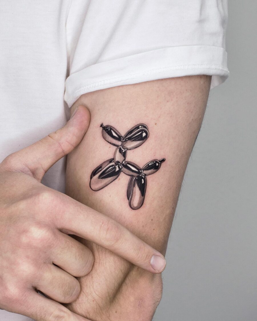 Unique silver ink balloon dog tattoo design Tattoo on skin