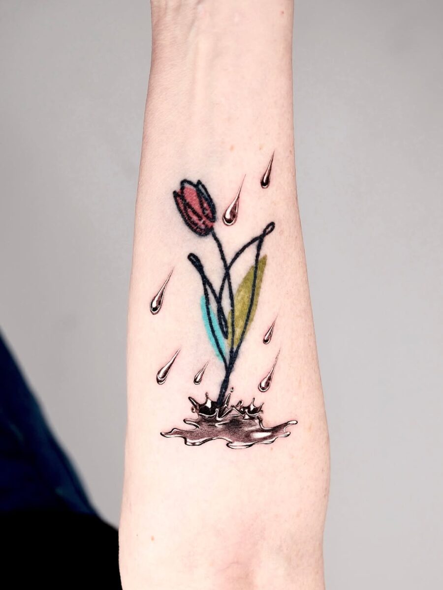 Unique silver ink floral tattoo with water elements Tattoo on skin