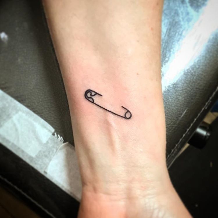 Cute Little Safety Pin Illusion Tattoo on skin