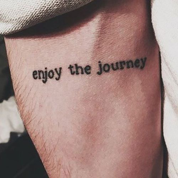 “Enjoy the Journey” Simple Text Tattoo Tattoo on skin